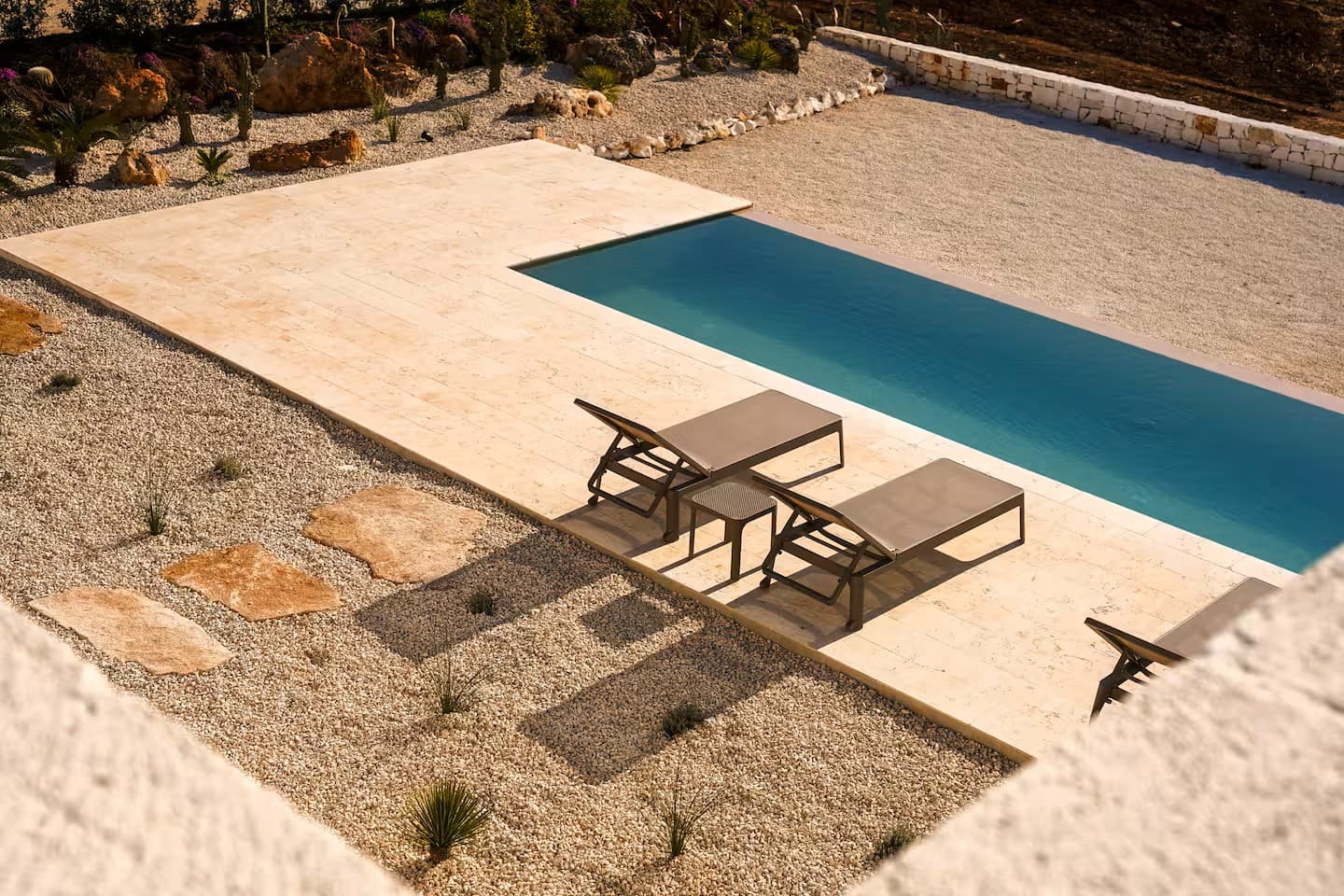 Private pool and travertine terrace at a villa in Puglia, seen from above